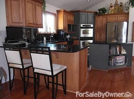 Gourmet Kitchen
						:
						View from breakfast nook. Maple cabinets, granite, island ceramic cooktop.
