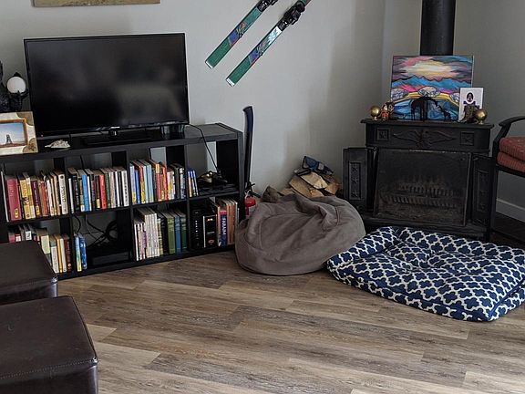 Part of the living area with wood burning fireplace