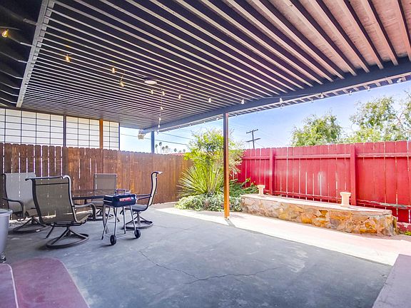Feel free to use the outdoor grill in the home's gated and covered backyard