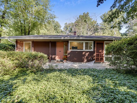 Front patio surrounded by lush plantings