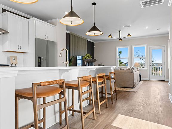 Extra Seating Opportunities with Kitchen Island. Model Home Representation.