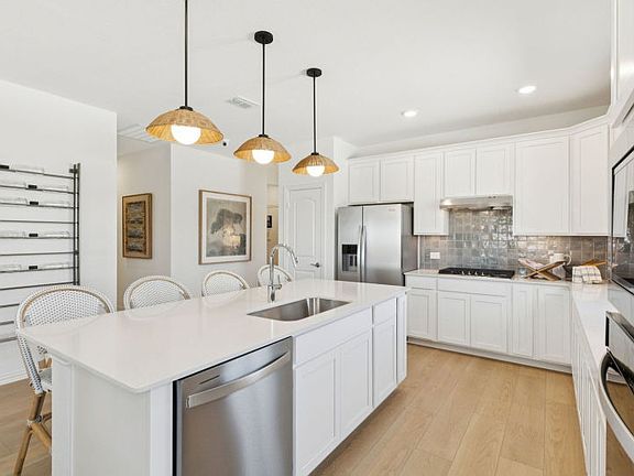 Spacious kitchen with pendant lighting