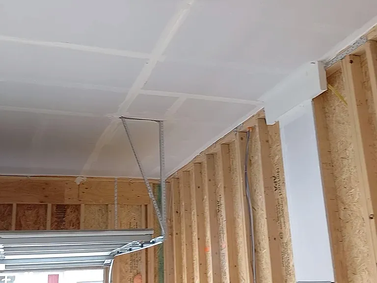Lots of headroom in the 2-car garage, with 11-foot tall ceilings