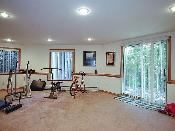 A sizable workout room with big windows and lots of light!