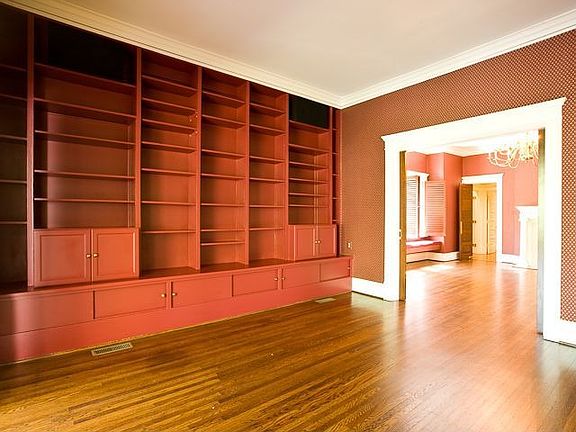 HANDSOME LIBRARY W CUSTOM BOOKCASES OPENS OFF THE GALLERY TO THE DINING ROOM