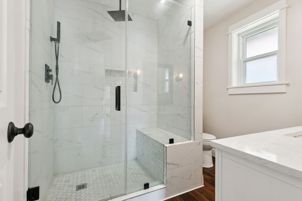 Primary bedroom bathroom with custom shower