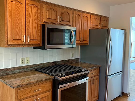 Kitchen has all new Whirlpool appliances (gas range, microwave, fridge, dishwasher)