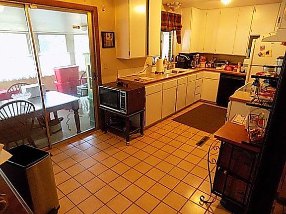 kitchen with view of sunroom