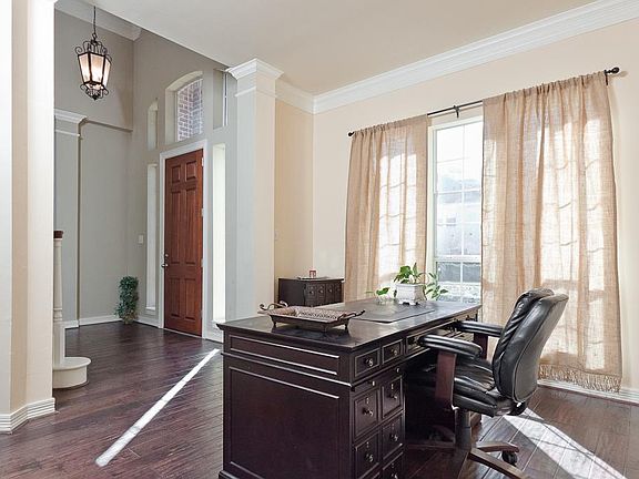 This room off the entry can be a formal living or study as shown here.