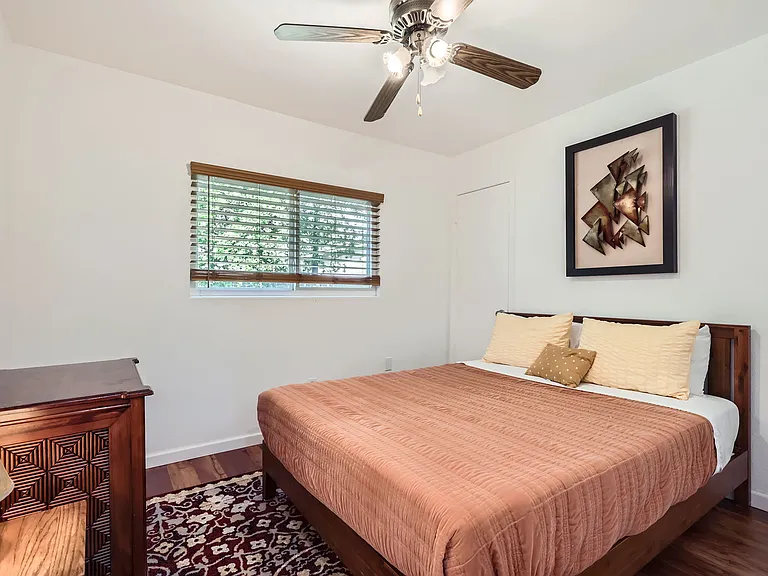 Bedroom with queen-sized bed.