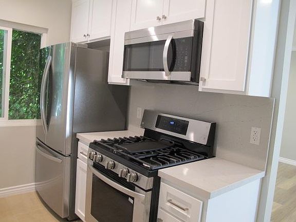 Kitchen with all new cabinets, counters, back splash, and LG stainless appliances.