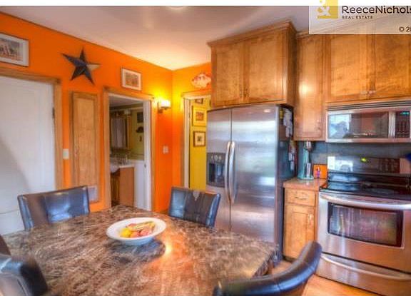 Eat in kitchen has been modernized with stainless steel applianc