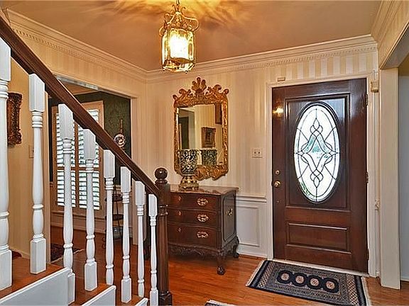 The entry way showing the beautiful front door.