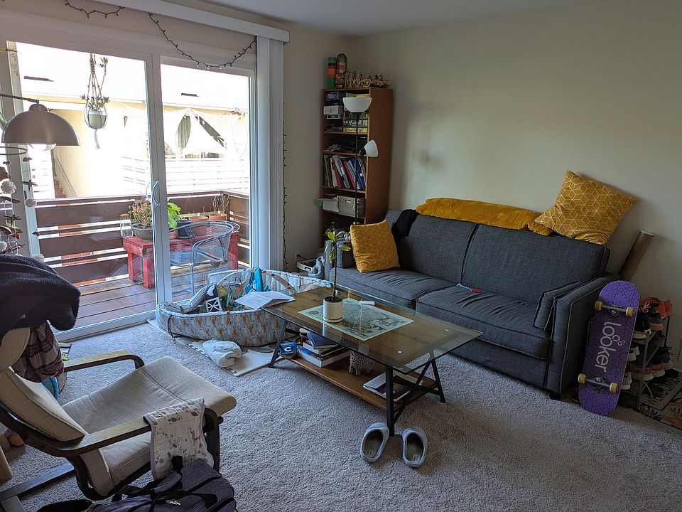 Living room with sliding glass doors and deck