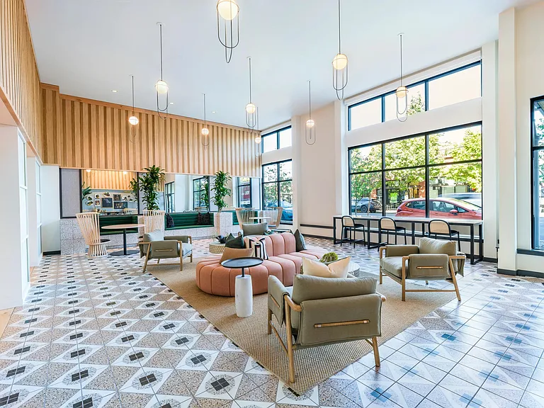 Welcome to a space where style meets comfort. The lobby at Modera Woodstock embraces you with Portland-inspired earthy tones, tactile accents, and whimsical mixed-media art. It's the perfect introduction to your ultimate home, where detailed finishes and
