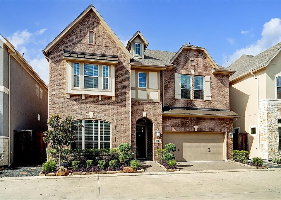 Stunning 5 bedroom/4.5 bath with a 2 car private garage