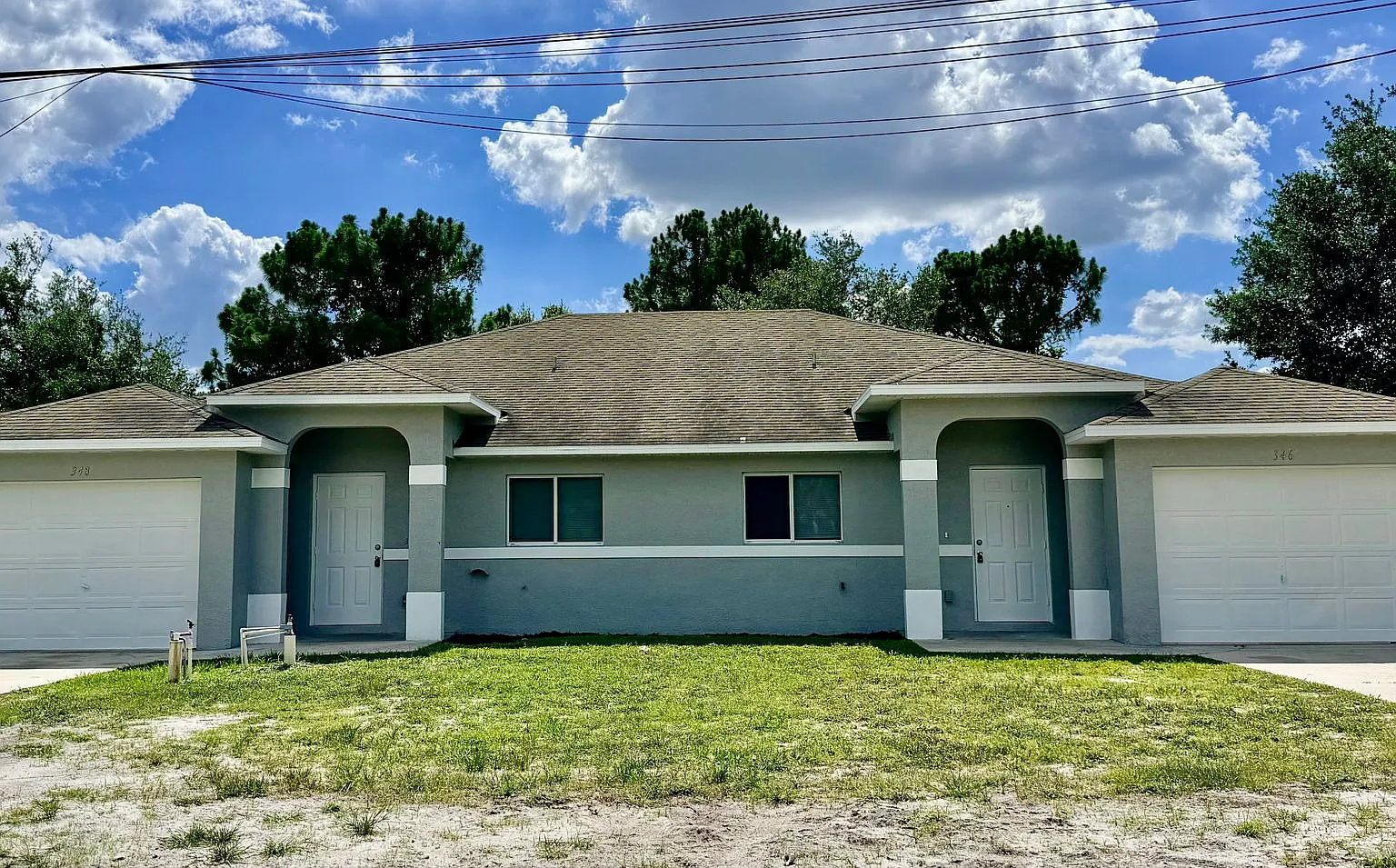 Charming 3BR/2BA Duplex with 1-Car Garage | Lawn Care & Salt Service Included — Photo 2