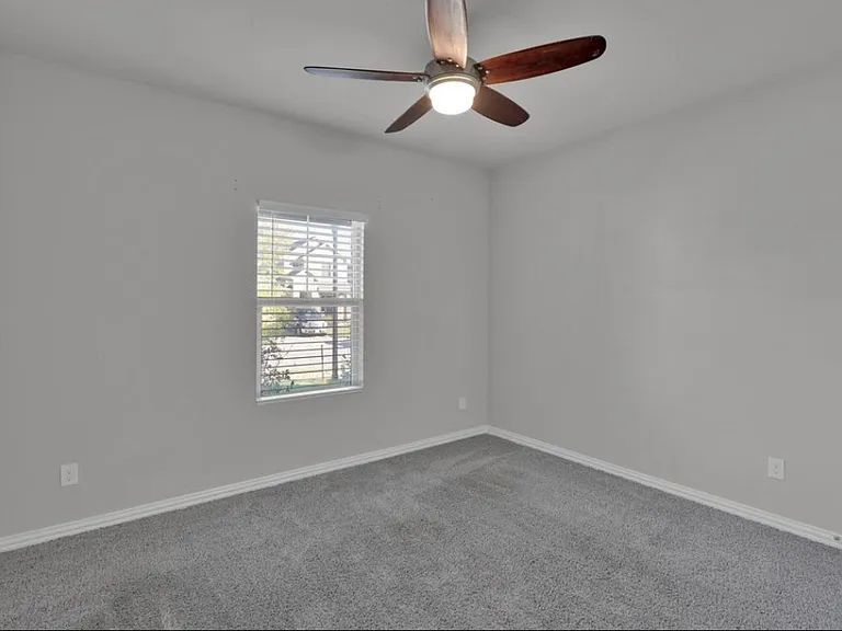 Bedroom 2_downstairs. Can be utilized as an office or study.