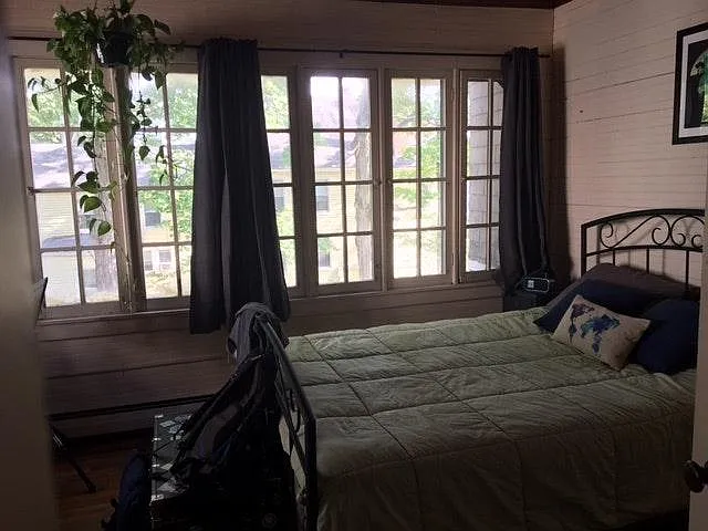 Beautiful bedroom with windows overlooking the yard