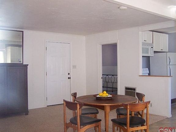 Master bedroom door to left of entry door, kitchen to right.