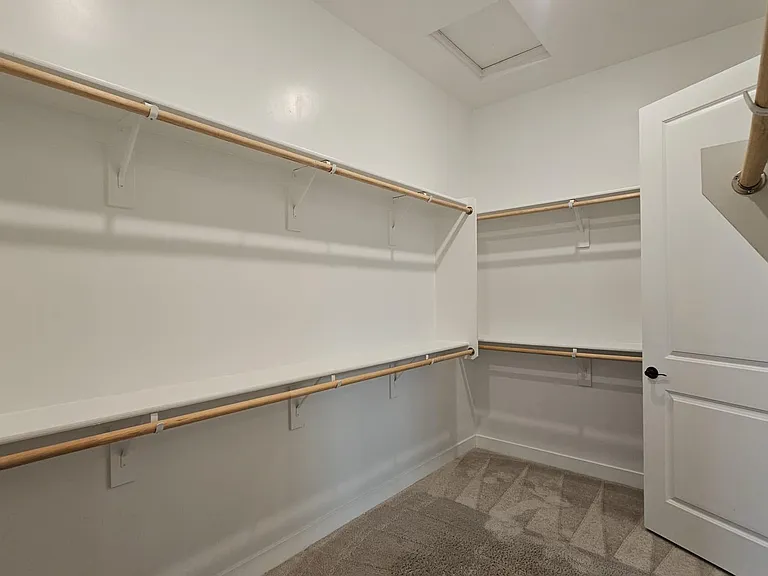 Large primary bedroom walk-in closet