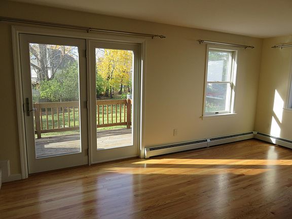 Living room, double doors open to private deck