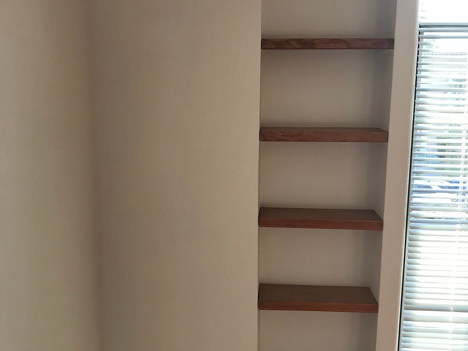 Original 1926 built in wall wood shelves.