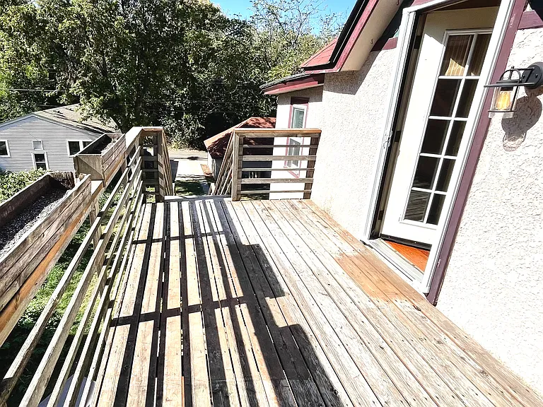 Back yard upper deck into kitchen, South facing.