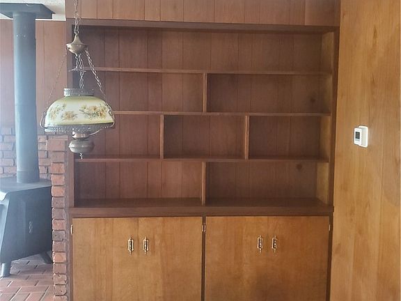 Custom built-in bookshelf and storage in family room.