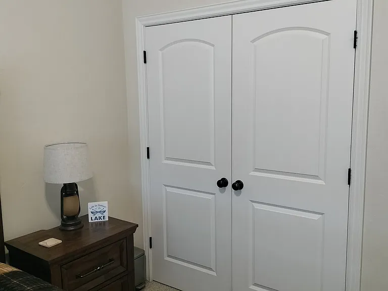 Two inviting guest bedrooms feature Smart TVs and convenient touch lighting, offering comfort and modern amenities for a relaxing stay. Perfect for unwinding and enjoying a restful night.