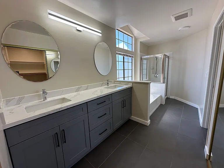 Beautifully updated primary bath with soaking tub and stall shower
