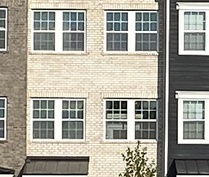 502 Hinton Street with street parking in the front and a two-car tandem garage in back.