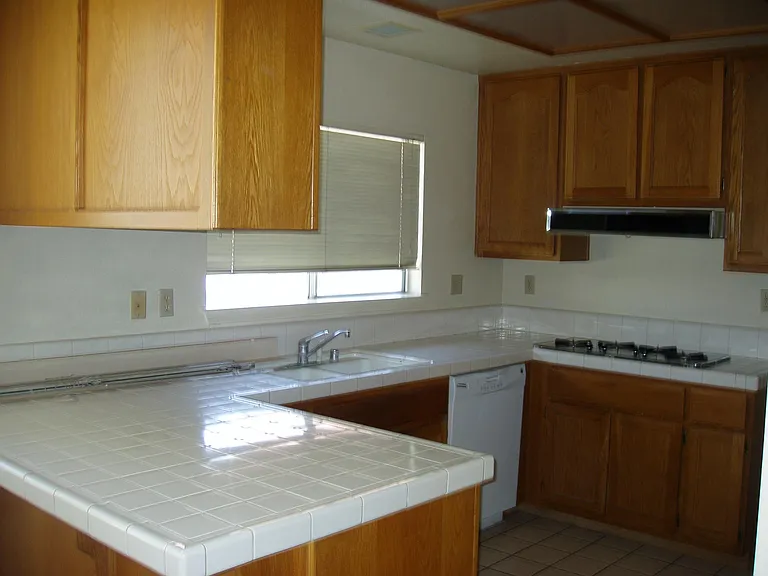 new updated kitchen coming by tomorrow. Kitchen-Empty But in process of getting new Granite counters!!