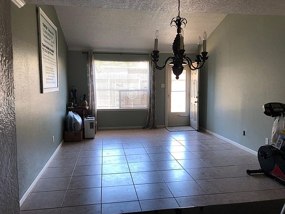 Living room with rear exit to patio and cover parking (2 spots)
