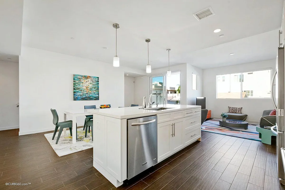 Open kitchen with dining and living room - 4050 Riviera Dr