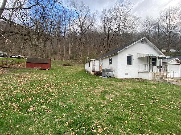 Large yard with storage building