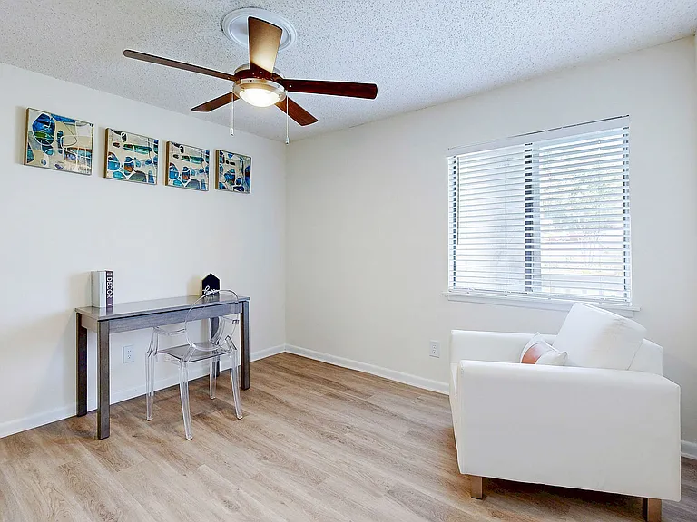 Bedroom with hardwood-style flooring & ceiling fan