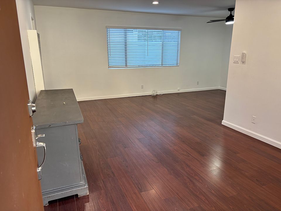 Spacious living room. TV console is optional and can be removed