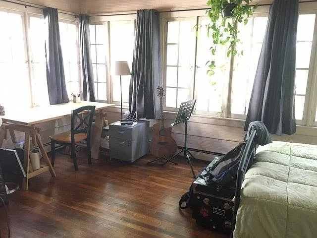 Beautiful bedroom with windows overlooking the yard