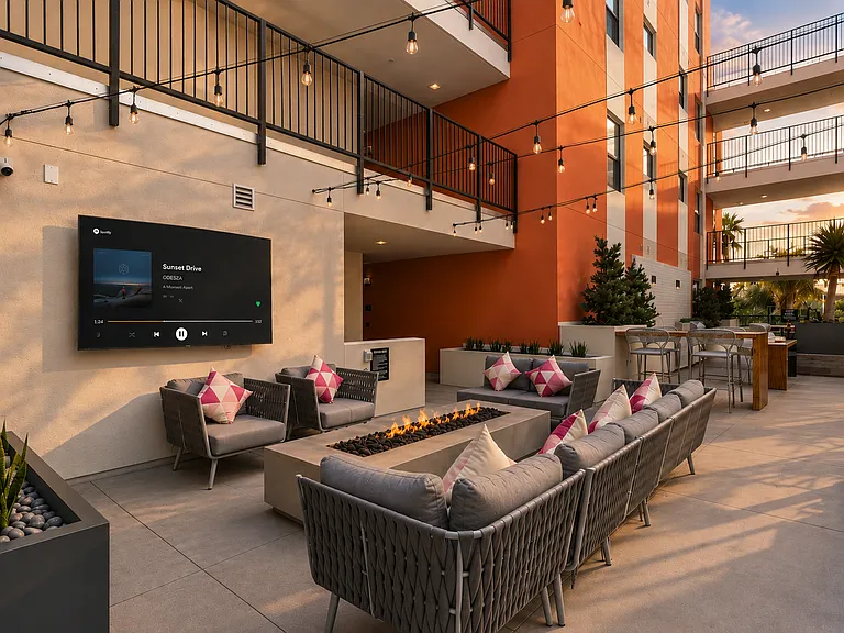 Courtyard lounge with fireplace and smart TV