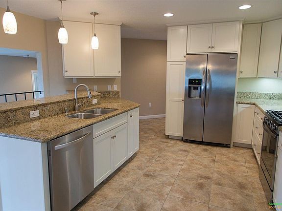 Recently Remodeled Kitchen with Stainless Steel Appliances and Granite Countertops