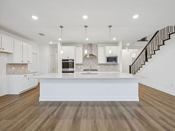 Spacious, eat-in island kitchen photos depict options and features that may not be available