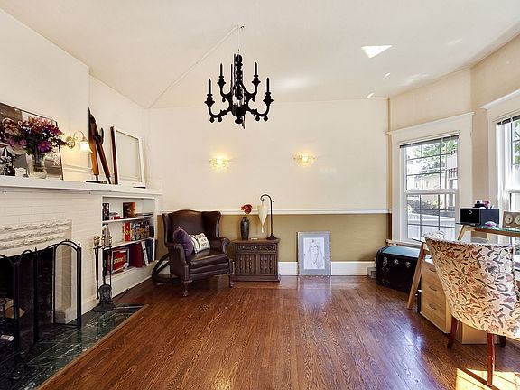 Main level unit dining room with original fireplace.