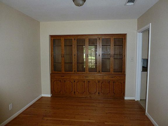 Dinning area with custom built china cabinet and hard wood floors