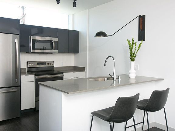 huge kitchen island w full size SS appliances TONS of storage