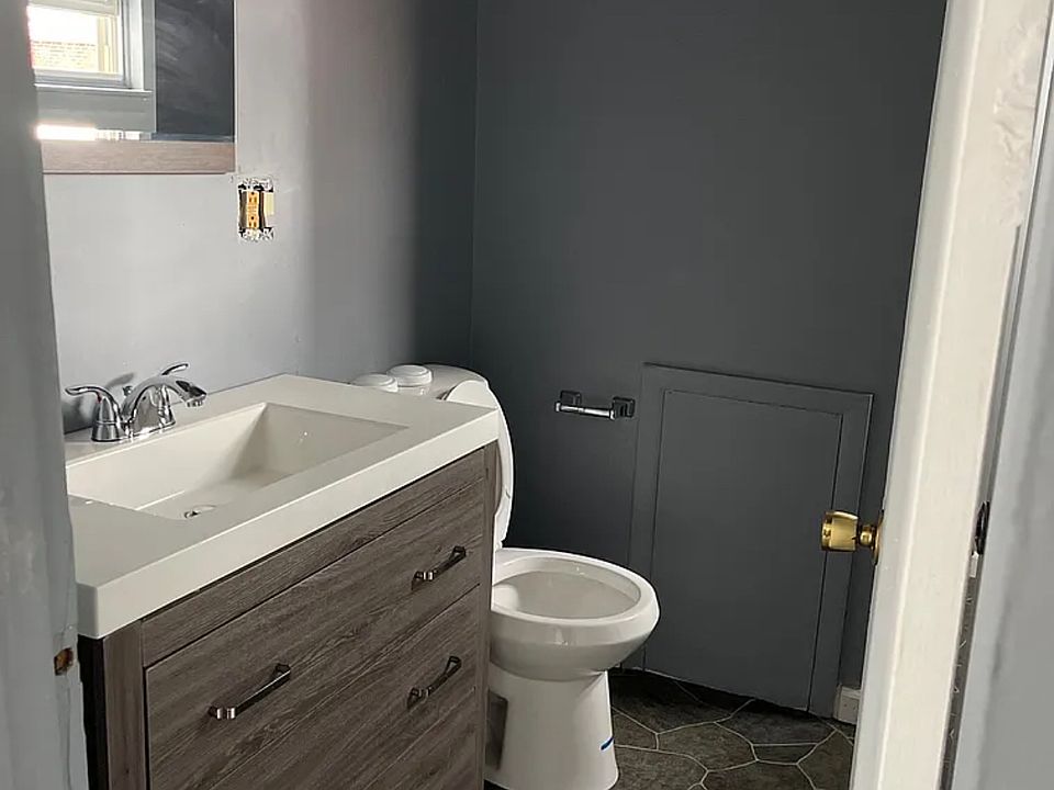 Modern spacious bathroom with stand-up shower.