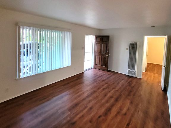 Living Room with new vertical blinds.