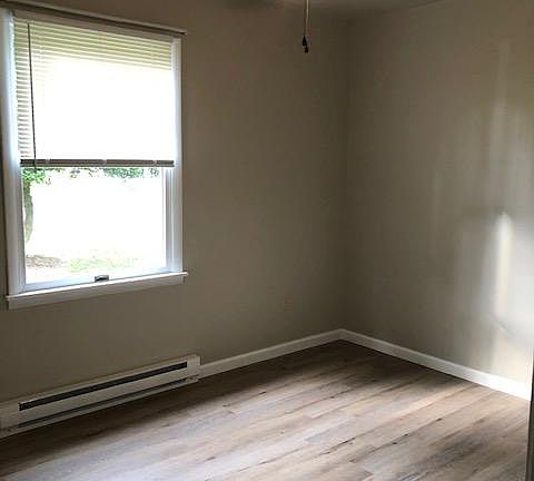 1 of 3 bedrooms - new flooring throughout.