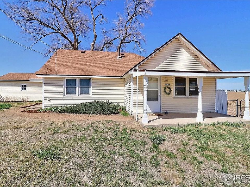 Outside, yard and garage to the left.