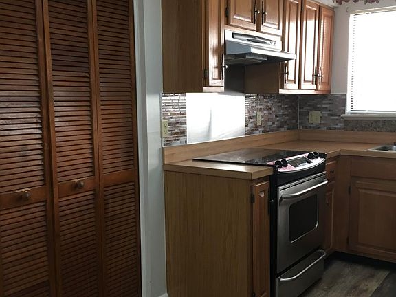 New kitchen flooring and backsplash welcome you home, and th